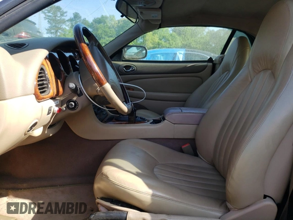 1999 Jaguar XK with VIN SAJGX2043XC040866, listed as a Copart auction lot 53712555 with 65,349 mi miles and Clean Title. Bid and sale history available at DreamBid. Image 7.