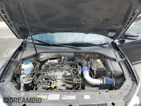2014 Volkswagen Passat SEL Premium z VIN 1VWCN7A36EC077099, wystawiony jako Copart lot #58440905 z przebiegiem 144 462 mil mil oraz Szkoda całkowita • Salvage title. Historia ofert i sprzedaży dostępna na DreamBid. Obrazek 11.