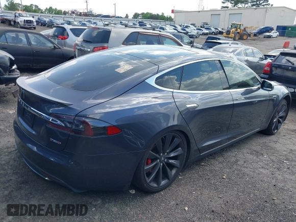 2014 Tesla Model S P85D with VIN 5YJSA1H29EFP63032, listed as a IAAI auction lot 42132145 with Not Provided miles and . Bid and sale history available at DreamBid. Image 4.
