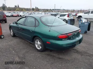 1999 Ford Taurus z VIN 1FAFP52S9XG309250, wystawiony jako IAAI lot #41797222 z przebiegiem 102 676 mil mil oraz . Historia ofert i sprzedaży dostępna na DreamBid. Obrazek 3.