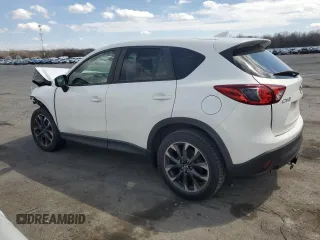 2016 Mazda CX-5 Grand Touring z VIN JM3KE2DY9G0645141, wystawiony jako Copart lot #50989635 z przebiegiem 123 898 mil mil oraz Szkoda całkowita • Salvage title. Historia ofert i sprzedaży dostępna na DreamBid. Obrazek 2.