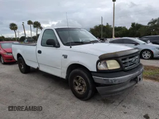 2003 Ford F-150 XL with VIN 1FTRF17W03NA02988, listed as a Copart auction lot 77209084 with Not Provided miles and Salvage Title. Bid and sale history available at DreamBid. Image 4.