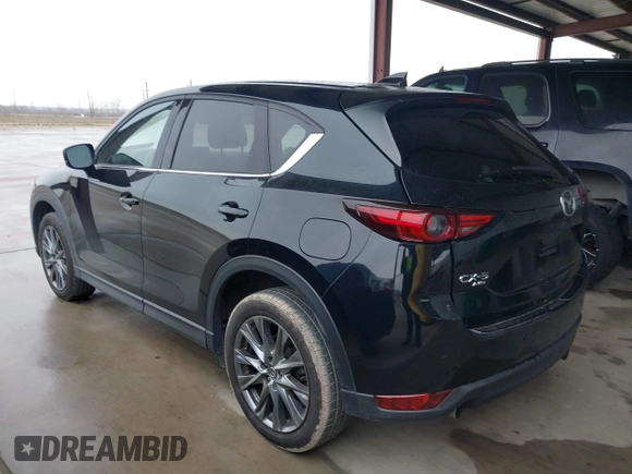 2021 Mazda CX-5 Signature with VIN JM3KFBEY5M0432033, listed as a IAAI auction lot 41607215 with 49,870 mi miles. Bid and sale history available at carsss.com. Image 3.