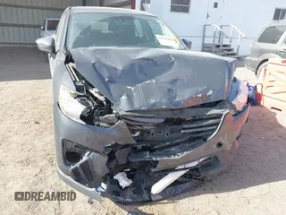 2016 Mazda CX-5 Sport with VIN JM3KE4BY0G0623365, listed as a IAAI auction lot 41525002 with 127,674 mi miles and . Bid and sale history available at carsss.com. Image 6.