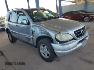2000 Mercedes-Benz M-Class with VIN 4JGAB54E1YA193102, listed as a Copart auction lot 74294404 with 202,107 mi miles and Salvage Title. Bid and sale history available at carsss.com. Image 4.