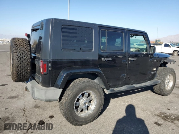 2010 Jeep Wrangler Unlimited Sahara with VIN 1J4BA5H17AL123479, listed as a Copart auction lot 49066315 with 114,419 mi miles and Salvage Title. Bid and sale history available at carsss.com. Image 3.