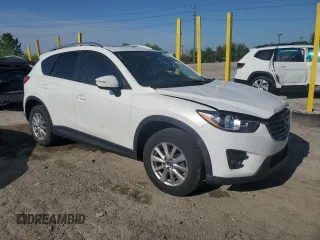 2016 Mazda CX-5 Touring z VIN JM3KE2CYXG0683673, wystawiony jako Copart lot #56724025 z przebiegiem 107 293 mil mil oraz Szkoda całkowita • Salvage title. Historia ofert i sprzedaży dostępna na DreamBid. Obrazek 4.