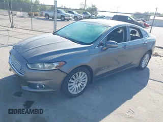 2013 Ford Fusion SE Hybrid with VIN 3FA6P0LU8DR161079, listed as a IAAI auction lot 42064615 with 232,448 mi miles. Bid and sale history available at carsss.com. Image 2.