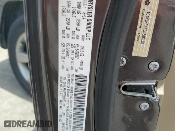 2014 Jeep Patriot High Altitude with VIN 1C4NJPFA2ED888925, listed as a Copart auction lot 60191435 with 122,308 mi miles and Salvage title. Bid and sale history available at DreamBid. Image 13.