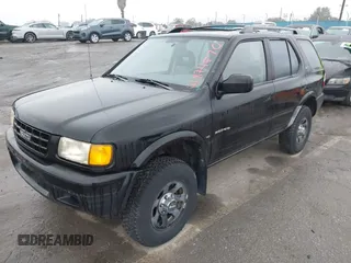 1998 Isuzu Rodeo S z VIN 4S2CM58W6W4336183, wystawiony jako IAAI lot #41874570 z przebiegiem 162 097 mil mil oraz . Historia ofert i sprzedaży dostępna na DreamBid. Obrazek 2.