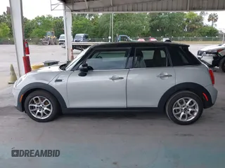 2019 MINI Hardtop 4 Door Cooper z VIN WMWXU1C59K2J02305, wystawiony jako IAAI lot #42205461 z przebiegiem 75 101 mil mil oraz . Historia ofert i sprzedaży dostępna na DreamBid. Obrazek 14.