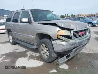2003 GMC Yukon SLT with VIN 1GKEC13V63R224713, listed as a IAAI auction lot 41825153 with 215,086 mi miles. Bid and sale history available at carsss.com. Image 1.