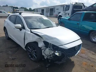 2018 Mazda 3 Touring z VIN 3MZBN1L39JM184985, wystawiony jako IAAI lot #42134316 z przebiegiem 123 773 mil mil oraz . Historia ofert i sprzedaży dostępna na DreamBid. Obrazek 1.