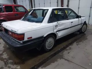 1990 Toyota Camry z VIN JT2SV21E5L3398379, wystawiony jako IAAI lot #41699413 z przebiegiem 100 136 mil mil oraz . Historia ofert i sprzedaży dostępna na DreamBid. Obrazek 4.