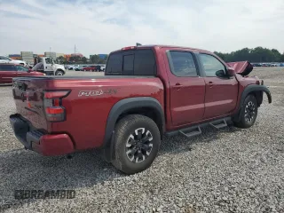 2022 Nissan Frontier Pro-4X with VIN 1N6ED1EK1NN601886, listed as a Copart auction lot 65182295 with 51,879 mi miles and Salvage title. Bid and sale history available at DreamBid. Image 3.