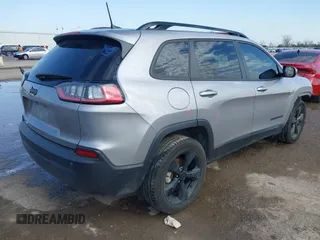 2021 Jeep Cherokee Altitude with VIN 1C4PJLLB6MD112830, listed as a IAAI auction lot 41560135 with 76,760 mi miles. Bid and sale history available at carsss.com. Image 4.