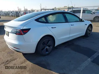 2023 Tesla Model 3 with VIN 5YJ3E1EA2PF582331, listed as a IAAI auction lot 41043858 with 33,601 mi miles and . Bid and sale history available at DreamBid. Image 4.