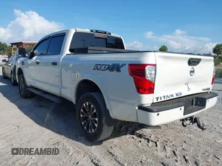 2016 Nissan Titan Platinum Reserve with VIN 1N6BA1F4XGN517905, listed as a IAAI auction lot 42676671 with 110,004 mi miles and . Bid and sale history available at DreamBid. Image 3.