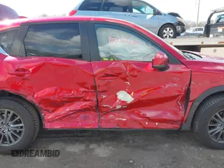 2021 Mazda CX-5 Touring z VIN JM3KFBCM1M0401717, wystawiony jako IAAI lot #42036407 z przebiegiem 35 587 mil mil oraz . Historia ofert i sprzedaży dostępna na DreamBid. Obrazek 6.