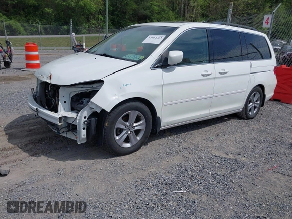 2010 Honda Odyssey Touring с VIN 5FNRL3H90AB039449, выставлен на аукционе IAAI как лот 42032203 с пробегом 128 265 миль миль и . История ставок и продаж доступна на DreamBid. Изображение 2.