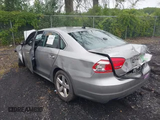 2013 Volkswagen Passat SE with VIN 1VWBP7A33DC041410, listed as a IAAI auction lot 42427033 with Not provided miles and . Bid and sale history available at DreamBid. Image 3.