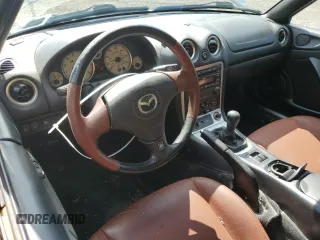 2002 Mazda MX-5 Miata Cloth z VIN JM1NB353520224582, wystawiony jako Copart lot #63669835 z przebiegiem 88 455 mil mil oraz Szkoda całkowita • Salvage title. Historia ofert i sprzedaży dostępna na DreamBid. Obrazek 8.