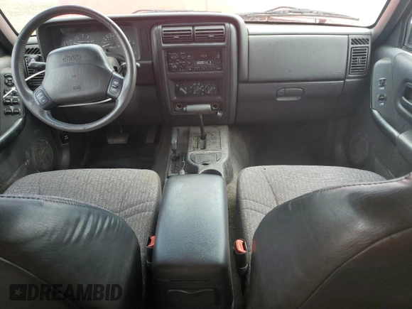 1999 Jeep Cherokee Sport with VIN 1J4FF68S4XL580048, listed as a Copart auction lot 62546365 with 154,059 mi miles and Clean title. Bid and sale history available at DreamBid. Image 8.
