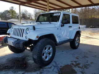 2014 Jeep Wrangler Sahara with VIN 1C4AJWBG1EL168007, listed as a Copart auction lot 87331394 with 113,228 mi miles and Salvage Title. Bid and sale history available at carsss.com. Image 1.