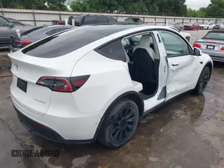 2022 Tesla Model Y Long Range z VIN 7SAYGDEE2NF420882, wystawiony jako IAAI lot #42023642 z przebiegiem 19 783 mil mil oraz . Historia ofert i sprzedaży dostępna na DreamBid. Obrazek 4.
