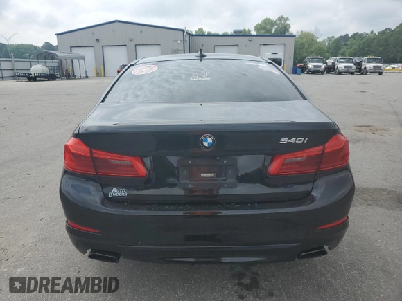 2018 BMW 5 Series 540i with VIN WBAJE5C54JWA93338, listed as a Copart auction lot 54312385 with 77,537 mi miles and Salvage title. Bid and sale history available at DreamBid. Image 6.