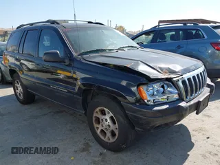 2001 Jeep Grand Cherokee Laredo z VIN 1J4GX48S01C523343, wystawiony jako IAAI lot #42453631 z przebiegiem 168 736 mil mil oraz . Historia ofert i sprzedaży dostępna na DreamBid. Obrazek 1.