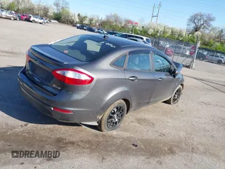 2015 Ford Fiesta SE with VIN 3FADP4BJ1FM128656, listed as a IAAI auction lot 41987997 with 106,588 mi miles. Bid and sale history available at carsss.com. Image 4.