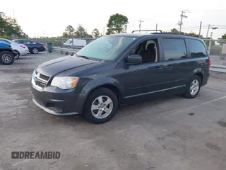 2012 Dodge Grand Caravan SXT with VIN 2C4RDGCG1CR141019, listed as a IAAI auction lot 42088541 with 148,931 mi miles and . Bid and sale history available at DreamBid. Image 2.