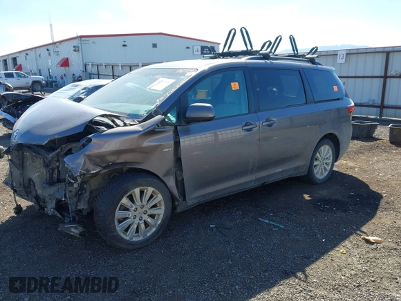2016 Toyota Sienna LE with VIN 5TDJK3DC9GS130774, listed as a IAAI auction lot 42033495 with 228,289 mi miles. Bid and sale history available at carsss.com. Image 2.