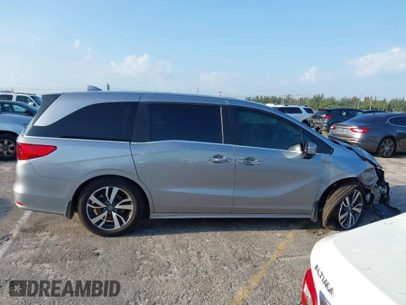 2023 Honda Odyssey Touring with VIN 5FNRL6H86PB020700, listed as a IAAI auction lot 41961098 with 66,512 mi miles and . Bid and sale history available at DreamBid. Image 13.