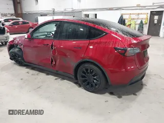 2024 Tesla Model Y Long Range with VIN 7SAYGAEE2RF986206, listed as a IAAI auction lot 42177852 with 14,399 mi miles and . Bid and sale history available at carsss.com. Image 3.