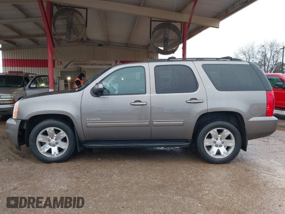2014 GMC Yukon SLT with VIN 1GKS1CE00ER164663, listed as a IAAI auction lot 41547771 with 178,998 mi miles. Bid and sale history available at carsss.com. Image 14.
