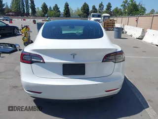 2020 Tesla Model 3 Standard Range Plus with VIN 5YJ3E1EAXLF590591, listed as a IAAI auction lot 42140338 with 79,342 mi miles and . Bid and sale history available at DreamBid. Image 17.
