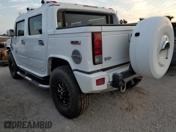 2006 Hummer H2 with VIN 5GRGN22U56H105928, listed as a Copart auction lot 76692904 with 0 mi miles and Salvage Title. Bid and sale history available at carsss.com. Image 2.