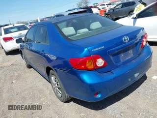 2009 Toyota Corolla with VIN 1NXBU40EX9Z065519, listed as a IAAI auction lot 42057981 with 201,480 mi miles. Bid and sale history available at carsss.com. Image 3.