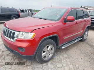 2011 Jeep Grand Cherokee Laredo with VIN 1J4RS4GG1BC673290, listed as a IAAI auction lot 42042557 with 147,590 mi miles and . Bid and sale history available at DreamBid. Image 2.