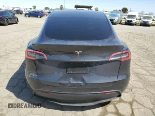 2025 Tesla Model Y Long Range with VIN 7SAYGDED4SF240354, listed as a Copart auction lot 52049745 with 6,785 mi miles and Salvage Title. Bid and sale history available at DreamBid. Image 6.