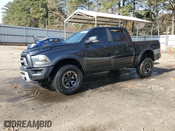 2017 Ram 1500 Rebel z VIN 1C6RR6YT7HS523912, wystawiony jako Copart lot #83148244 z przebiegiem Nie podano mil oraz Szkoda całkowita • Salvage title. Historia ofert i sprzedaży dostępna na DreamBid. Obrazek 1.