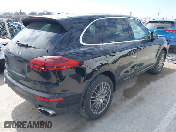 2016 Porsche Cayenne with VIN WP1AA2A25GKA15765, listed as a IAAI auction lot 41715331 with 90,259 mi miles. Bid and sale history available at carsss.com. Image 4.