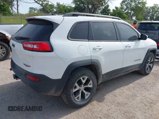 2015 Jeep Cherokee Trailhawk with VIN 1C4PJMBS6FW687718, listed as a IAAI auction lot 42505169 with 122,526 mi miles and . Bid and sale history available at DreamBid. Image 4.