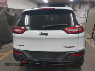 2015 Jeep Cherokee Trailhawk with VIN 1C4PJMBS1FW665500, listed as a IAAI auction lot 42068268 with 127,246 mi miles. Bid and sale history available at carsss.com. Image 17.