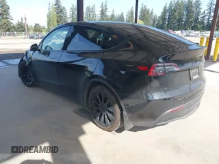 2022 Tesla Model Y Long Range with VIN 7SAYGDEE1NF550202, listed as a IAAI auction lot 42121718 with 28,211 mi miles and . Bid and sale history available at carsss.com. Image 3.