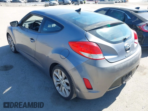 2013 Hyundai Veloster w/Black Int with VIN KMHTC6AD5DU095867, listed as a IAAI auction lot 42698380 with 115,528 mi miles and . Bid and sale history available at DreamBid. Image 3.