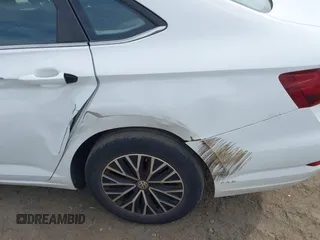 2021 Volkswagen Jetta S z VIN 3VWC57BU0MM021874, wystawiony jako IAAI lot #42124747 z przebiegiem 89 887 mil mil oraz . Historia ofert i sprzedaży dostępna na DreamBid. Obrazek 6.