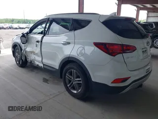 2018 Hyundai Santa Fe 2.4L z VIN 5NMZU3LB9JH083018, wystawiony jako IAAI lot #42205310 z przebiegiem 65 504 mil mil oraz . Historia ofert i sprzedaży dostępna na DreamBid. Obrazek 3.